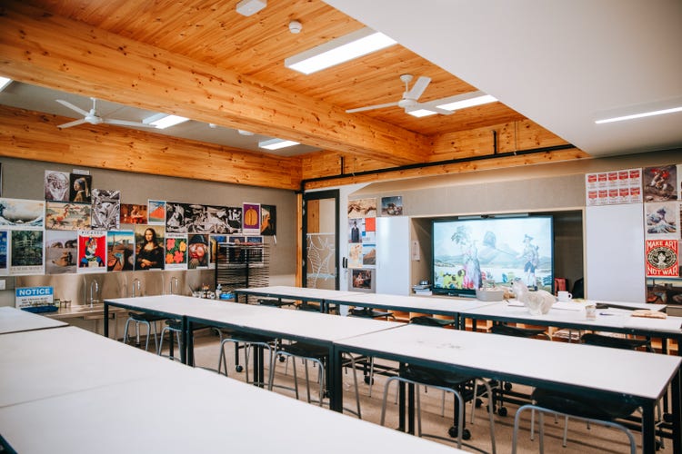 Photograph of Wee Waa High School art room with student artwork on walls, high timber ceilings, and natural light