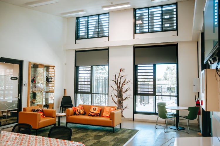 Photograph of interior of Binaalbaa room with floor to ceiling windows, lounges, high ceilings and natural light